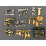Nine Jonette Jewelry Company sports pin brooches, with one pin badge, including golf, skiing,