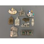 Nine Jonette Jewelry Company pin brooches, with a bookmark, including religious buildings, classical