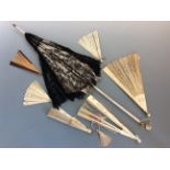 Five various fans and one black lace parasol. IMPORTANT: Online viewing and bidding only. No in