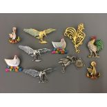 Ten Jonette Jewelry bird pin brooches, including herons, hens with eggs, chick hatching and rooster.