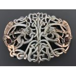 A Samuel Jacob London 1907 dragon design silver belt buckle with ruby coloured stones set into