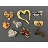 Nine Jonette Jewelry pin brooches, including hearts, heart shaped box, ‘way to my heart’, ‘he