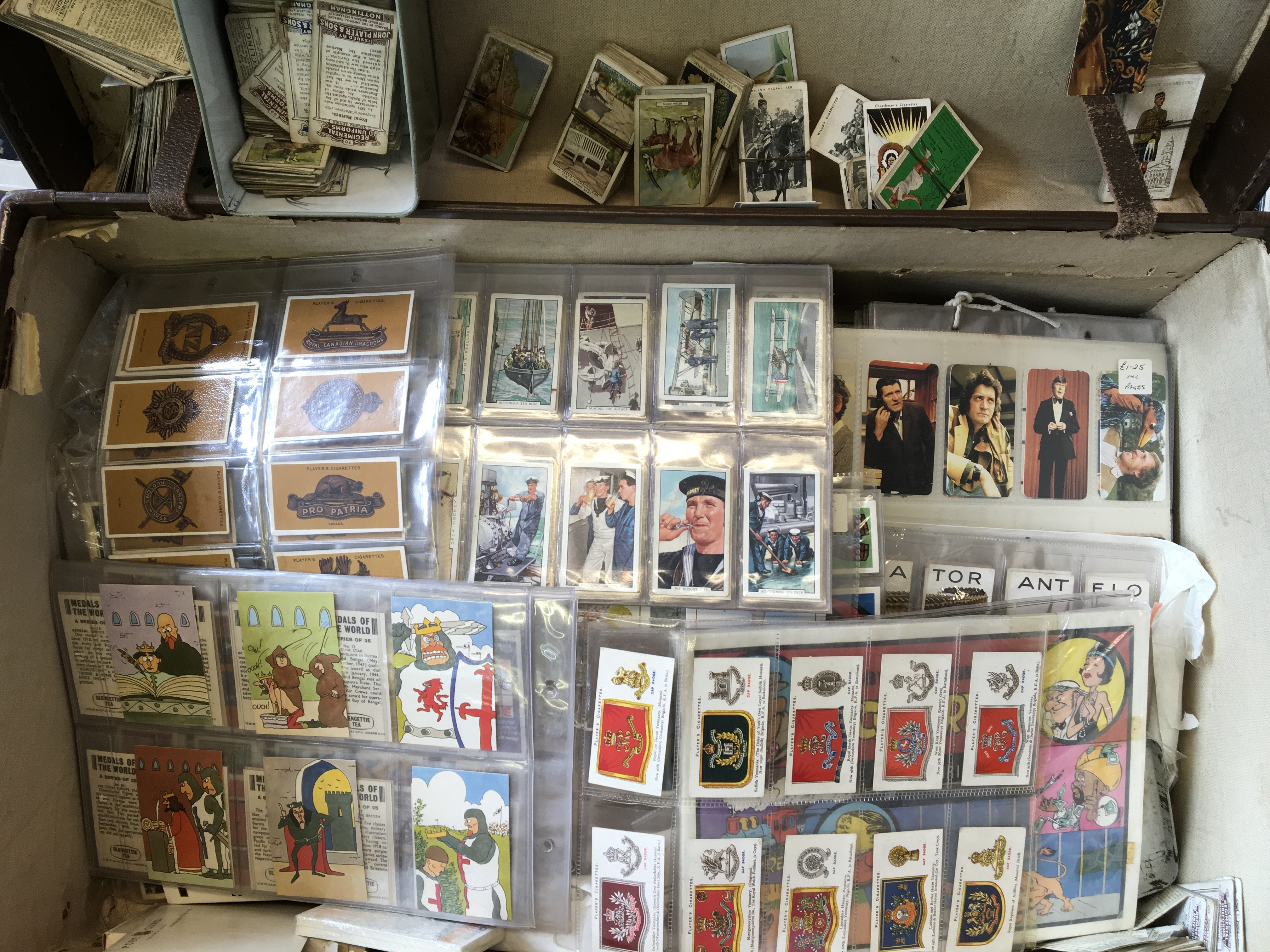 A suitcase containing various cigarette cards. IMPORTANT: Online viewing and bidding only. No in