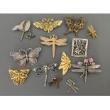 Ten Jonette Jewelry Company Butterfly and dragonfly pin brooches, with two pin badges and a charm.