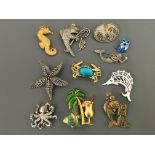 Ten Jonette Jewelry Company sea life pin brooches, with one badge, including seahorse, octopus,