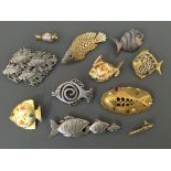 Nine Jonette Jewelry Company fish pin brooches, with two pin badges. IMPORTANT: Online viewing and