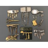 Nine Jonette Jewelry Company pin brooches, some with hanging charms, including sewing, comb,