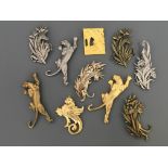 Ten Jonette Jewelry Company safari animal pin brooches, including jaguars, zebras and giraffe.