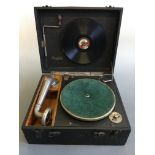 A cased Maxitone Gramophone with records. IMPORTANT: Online viewing and bidding only. No in person