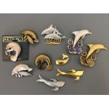 Ten Jonette Jewelry Company sea life pin brooches, including manatees, dolphins and whales.