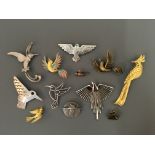 Ten Jonette Jewelry bird pin brooches, with two pin badges, including heron, hummingbird and