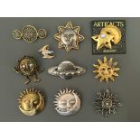 Nine Jonette Jewellery pin brooches, with one badge, including sun, moon, stars and planet.