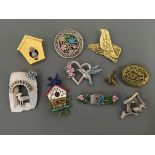 Nine Jonette Jewelry bird pin brooches, with three pin badges, including birds in houses and birds