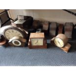 A selection of various clocks, clock faces and barometers, including two hall clocks, mantel clocks,