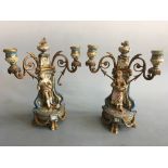 Two Sevres style ormolu and painted porcelain candelabras with male and female figurines, damage