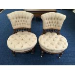 A pair of late 19th century beige button upholstered nursing chairs.