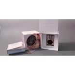 *A MICHAEL KORS Gent's Smart wrist watch, black face on link bracelet strap, spare links, in box.