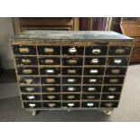 A thirty five drawer index chest on casters, chest dimensions 122cm x 61cm x 88.5cm. IMPORTANT: