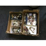 Two boxes of various costume jewellery. IMPORTANT: Online viewing and bidding only.