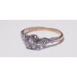 A 18ct yellow gold and platinum set single stone diamond ring, ring size J, approx. weight 2.0gms.