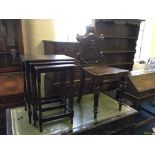 A mahogany hall chair with a nest of three coffee tables