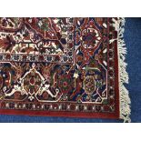 A red traditional pattern rug, 360cm x 275cm. IMPORTANT: Online viewing and bidding only.