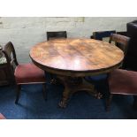 A 19th century rosewood round topped tilt dining table