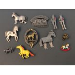 Eight Jonette Jewelry horse pin brooches and three badges. IMPORTANT: Online viewing and bidding