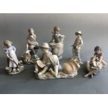 Five Lladro figurines including girl with lamb (finger chipped), girls with cats, boy and girl