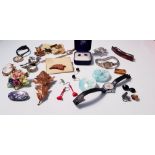 A collection of costume jewellery, to include earrings, brooches, badges, ladies wrist watches.