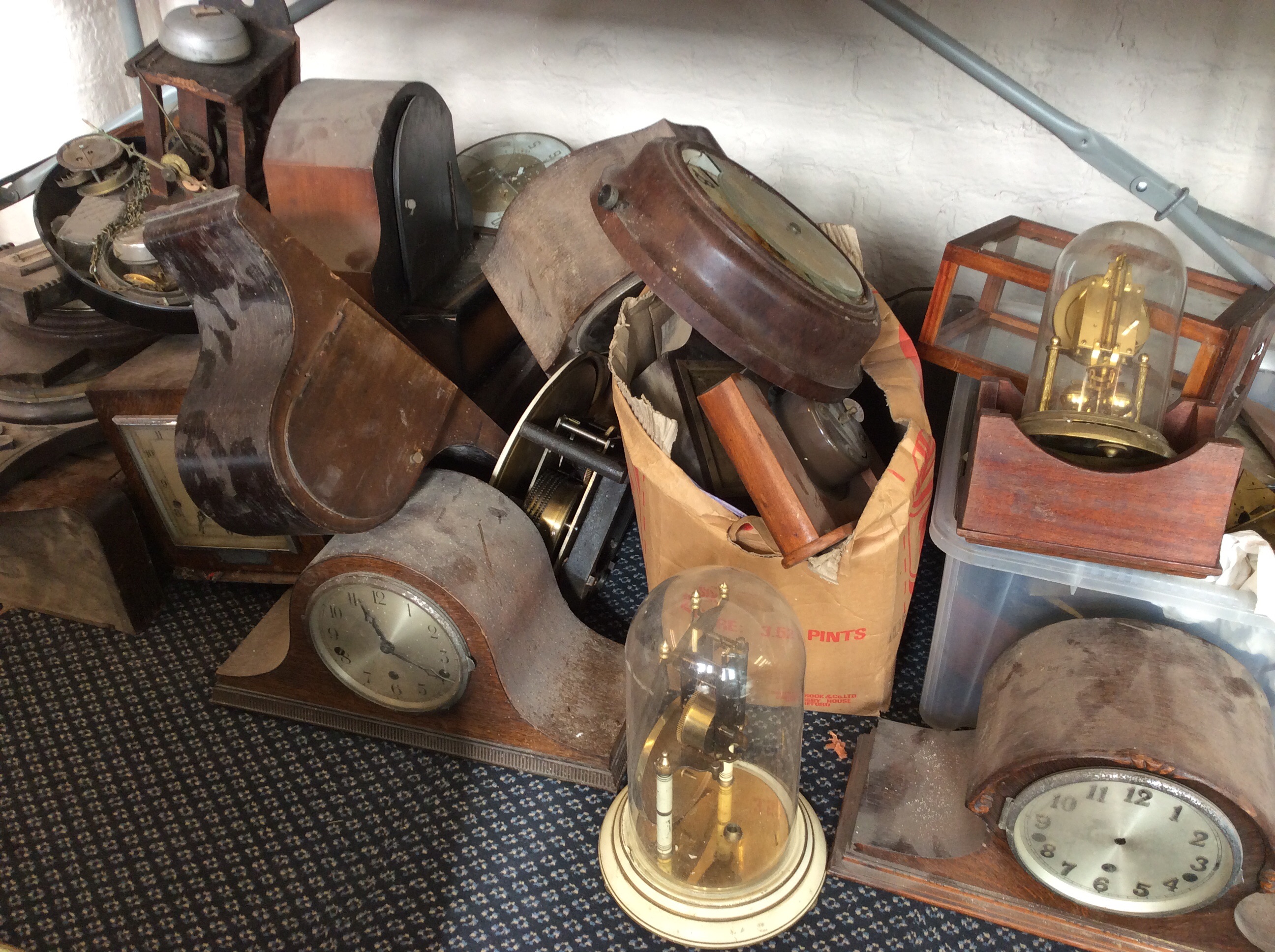 A selection of various clocks, clock parts and barometers, including glass domed clocks, mantel