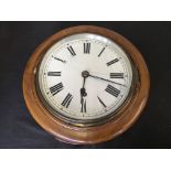 A mahogany cased ships wall clock, diameter 27cm, glass to face cracked. IMPORTANT: Online viewing