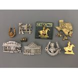 Eight Jewelry Company pin brooches, with a pin badge, including Texas map, sheriffs office,