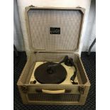 A Trixette portable electric gramaphone. IMPORTANT: Online viewing and bidding only. No in person