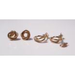 A pair of yellow gold marked 375 circular twist design stud earrings,approx.weight 2gms, and a