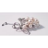 A Mikimoto pearl brooch, set with fifteen variously sized pearls, smallest measuring approx. 5.5mm