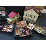 A white and brown painted dolls house mansion with a GB Toys dolls house and four boxes of dolls