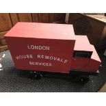 *A red and black painted stage prop van ‘London House Removal Service’. IMPORTANT: Online viewing