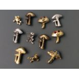 Eight Jonette Jewelry mushroom pin brooches and three frog badges. IMPORTANT: Online viewing and