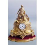 An I. Simmons Paris glass dome cased ormolu clock with swag and coat of arms design, topped with
