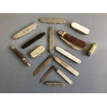 Two silver and mother of pearl fruit knives with eleven other folding pocket knives. IMPORTANT: