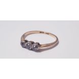 A18ct yellow gold and platinum three stone diamond ring rub over setting, ring size M, approx.