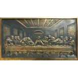 A bronze plaque depicting the Last Supper, with Latin inscription to base, ‘I tell you, one of you
