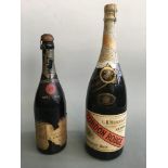 A bottle of 1943 Dry Imperial Moët & Chandon Champagne and a bottle of 1966 G.H. Mumm & Co. Cordon