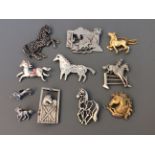 Nine Jonette Jewelry horse and unicorn pin brooches and two badges. IMPORTANT: Online viewing and