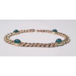A yellow gold marked 750 link bracelet with four cabochan emeralds, approx. weight 24gms. IMPORTANT:
