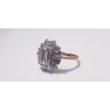A yellow gold marked 750, diamond flower design ring, central diamond approx. 1.0ct, 8 round