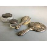 A silver cased mirror and hairbrush with Tiffany & Co. powder pots. IMPORTANT: Online viewing and