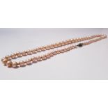 A string of pearls with gold and pearl clasp (broken), approx. weight 16.4 gms. IMPORTANT: Online