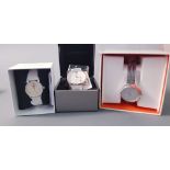 *A Gent's EMPORIO ARMANI wrist watch, white face on white link strap in box, a Lady's Karen Millen